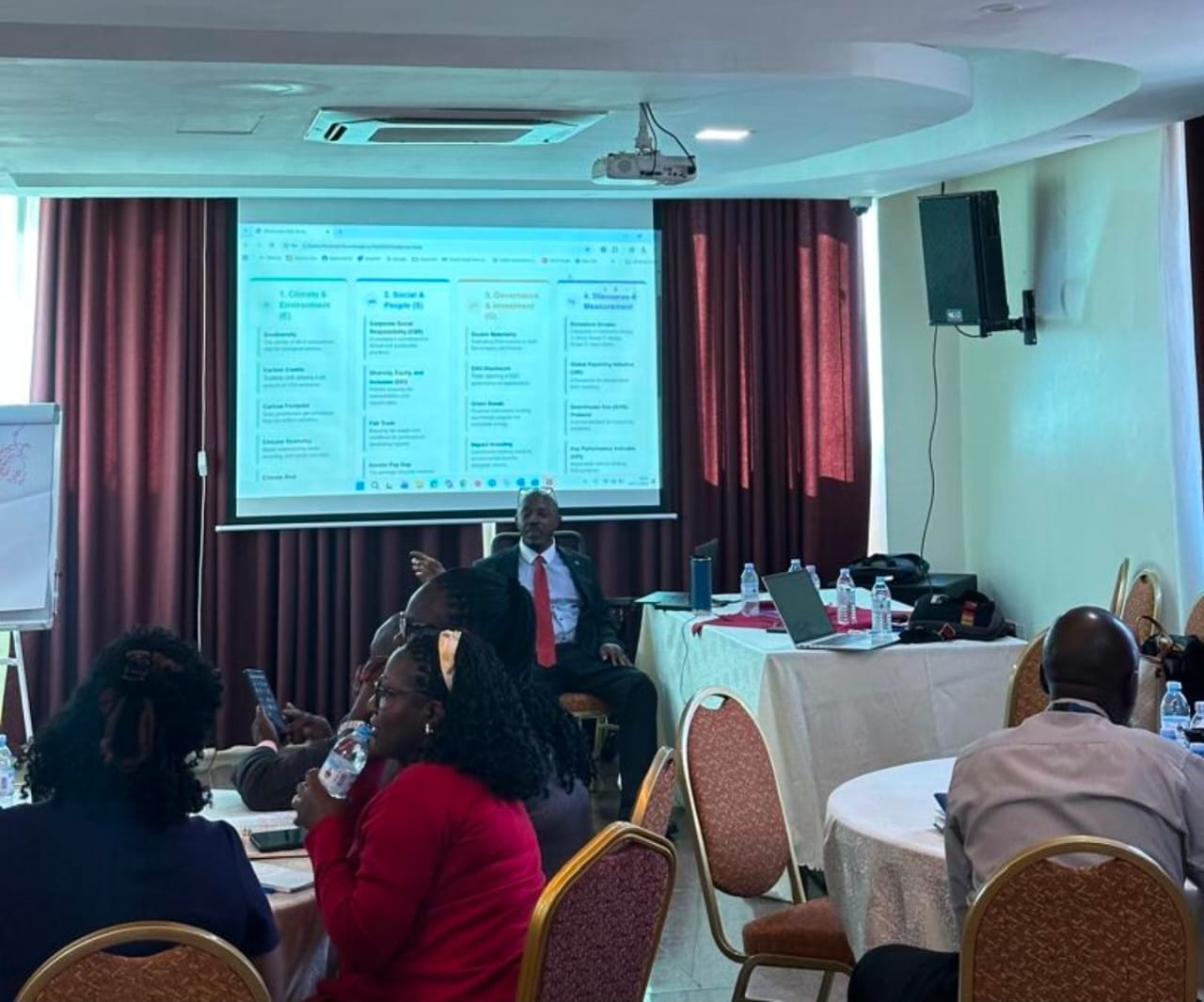 PKF coach leading ESG training session for Centenary Bank